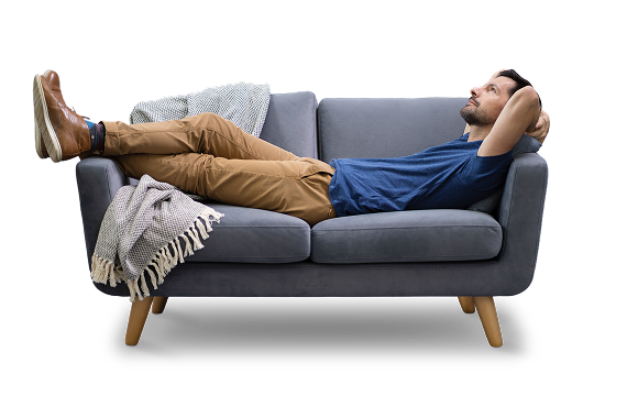 Guy relaxes on loveseat with his feed up - transparent background