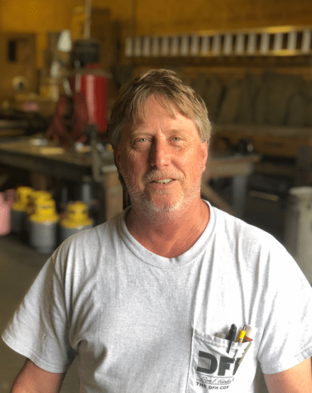 Portrait of a DFH technician in the workshop